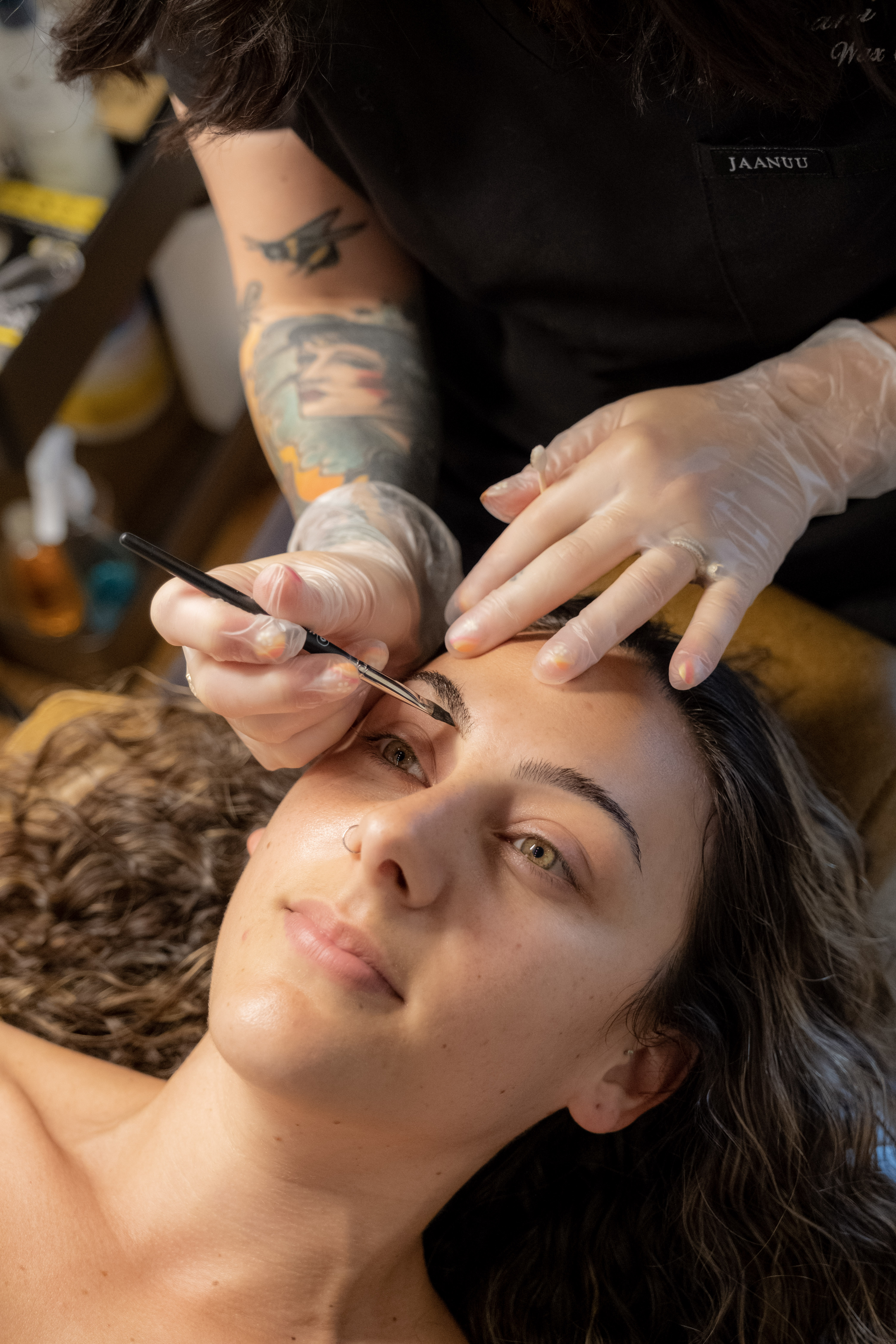 Brow lamination result — full, lifted, brushed-up brows